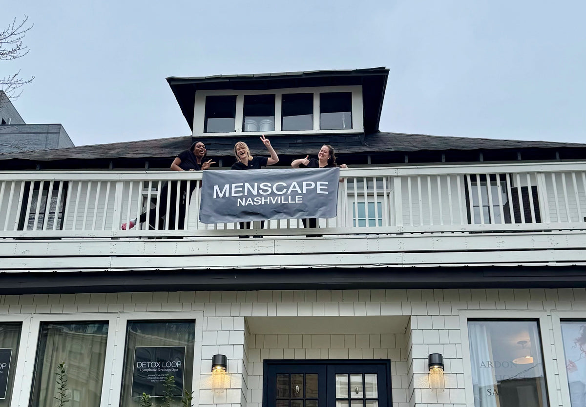 Sign hanging outside of Menscape Nashville